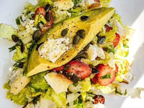 Vegan Recipes Cacao-Shamaness Fresh Salad with Lettuce, Strawberries, Avocado, toasted Pumpkin Seeds, Vegan Baked almond Feta Cheese