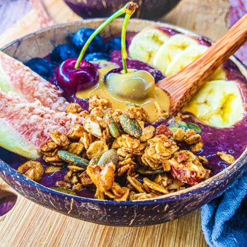 Vegan Recipes Cacao-Shamaness Vegan Acai Smoothie Bowl with Fresh Fruits, Homemade Granola, and Organic Peanut Butter.