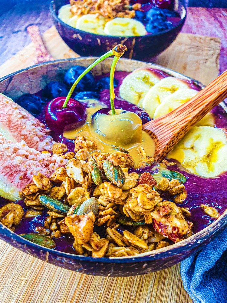 Vegan Recipes Cacao-Shamaness Vegan Acai Smoothie Bowl with Fresh Fruits, Homemade Granola, and Organic Peanut Butter.