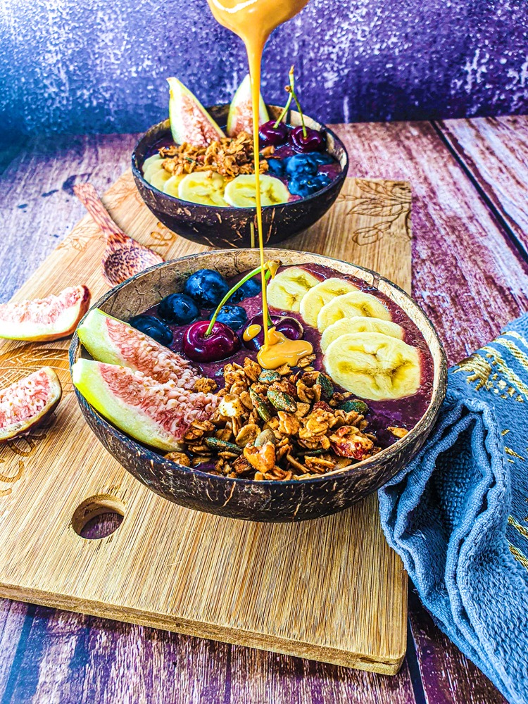 Vegan Recipes Cacao-Shamaness Vegan Acai Smoothie Bowl with Fresh Fruits, Homemade Granola, and Organic Peanut Butter.